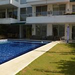 Amplio y cómodo apto para 6 a Max 12 personas con piscina privada en Laguna Club